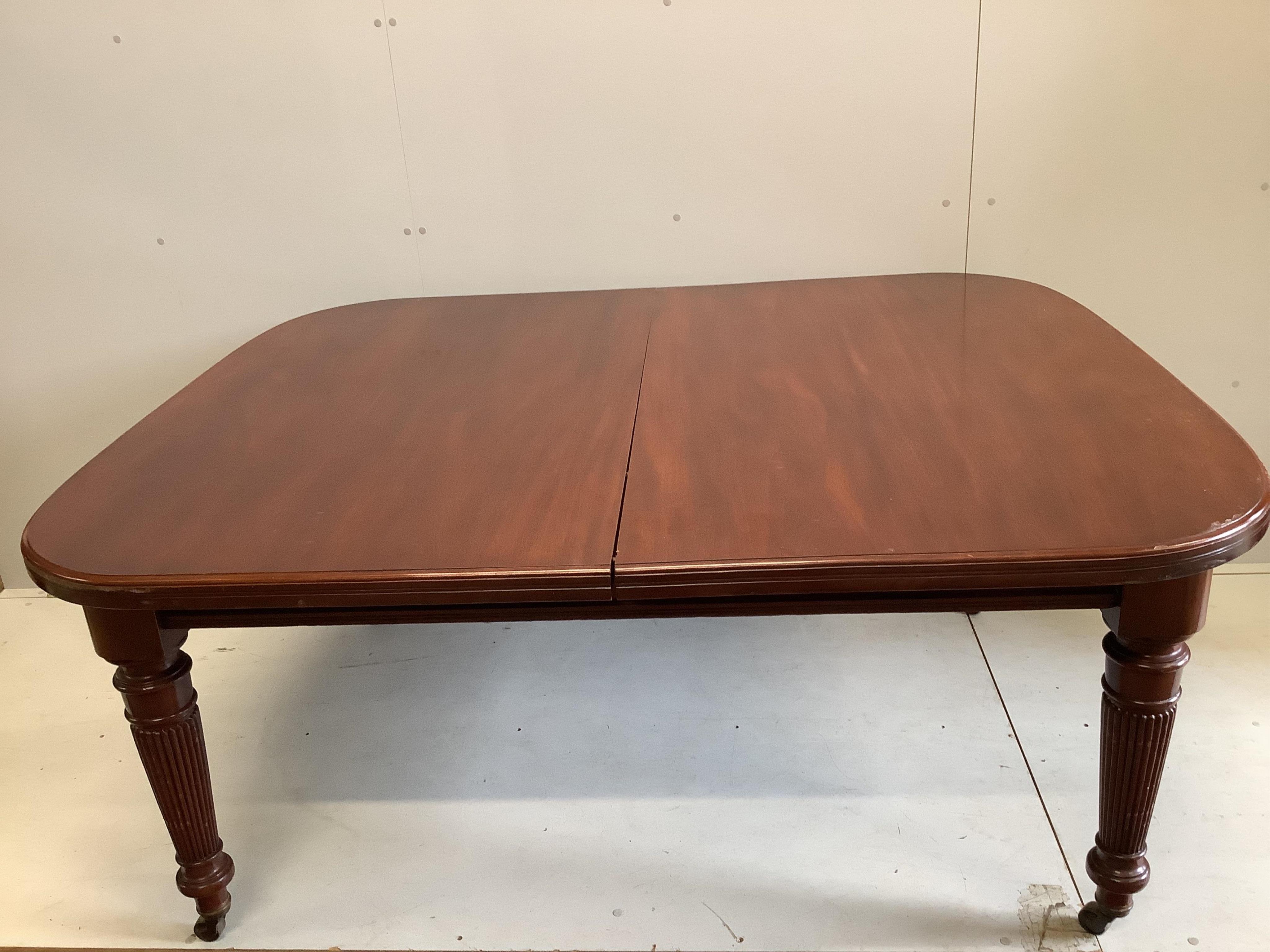 A late Victorian mahogany extending dining table, width 270cm extended, three spare leaves, depth 136cm, height 74cm. Condition - fair